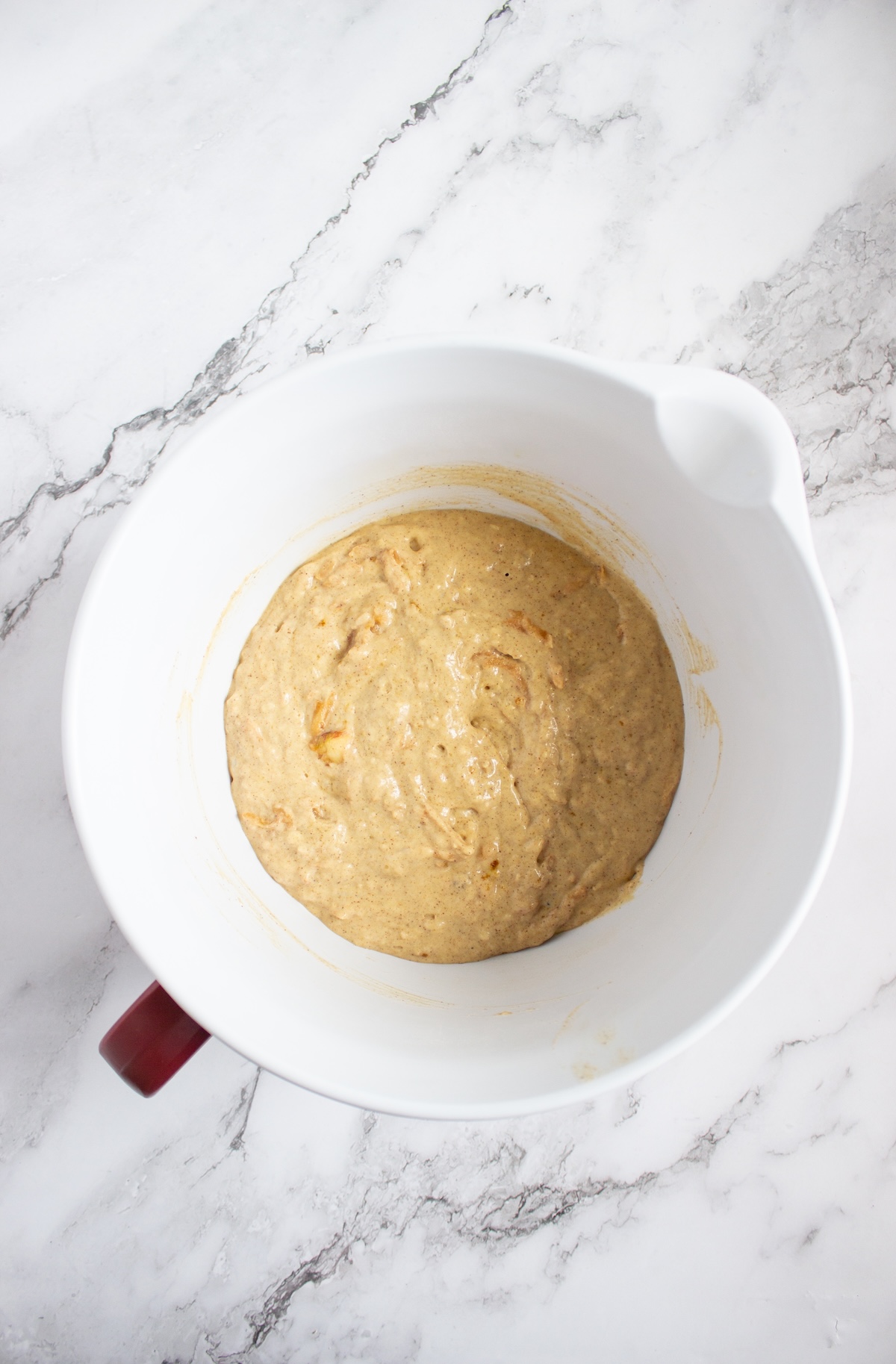 Apple cinnamon pancake batter with grated apple folded in
