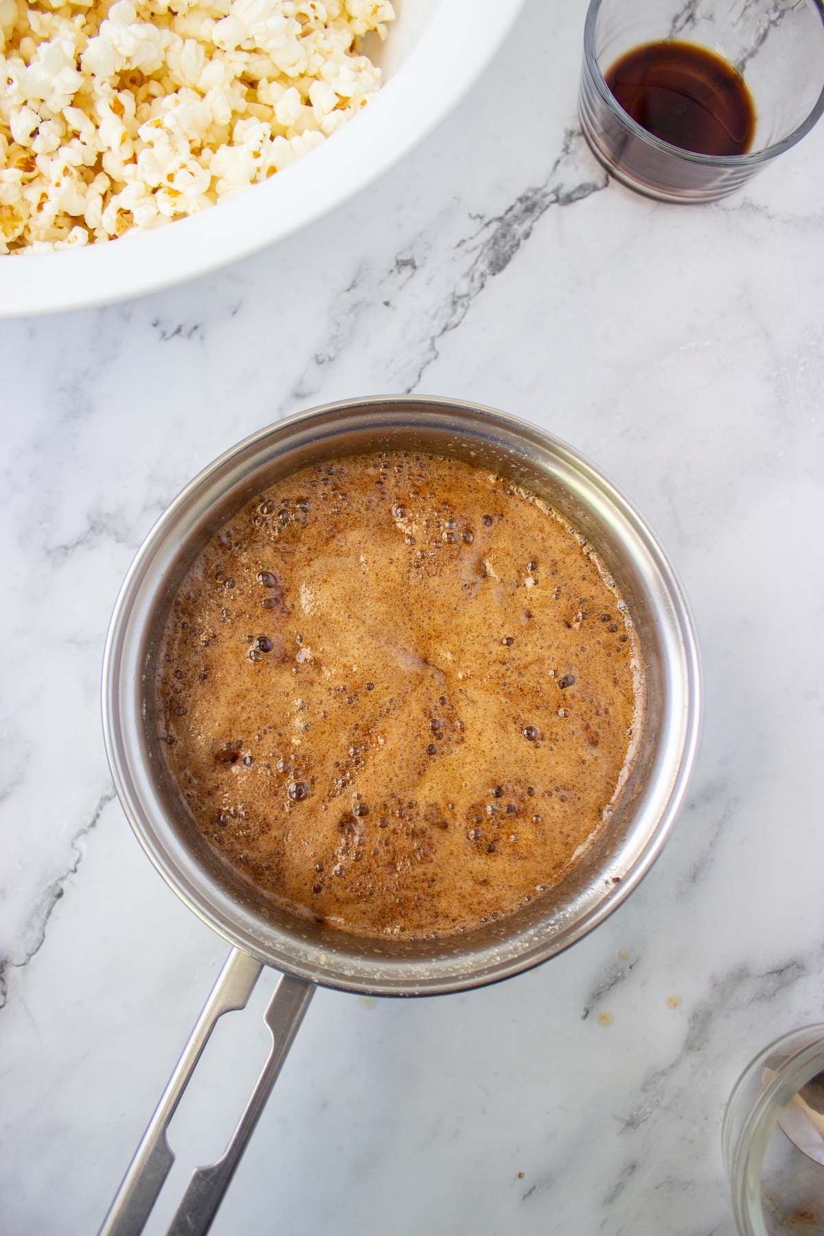 Foamy brown butter maple caramel sauce ready to pour over popcorn