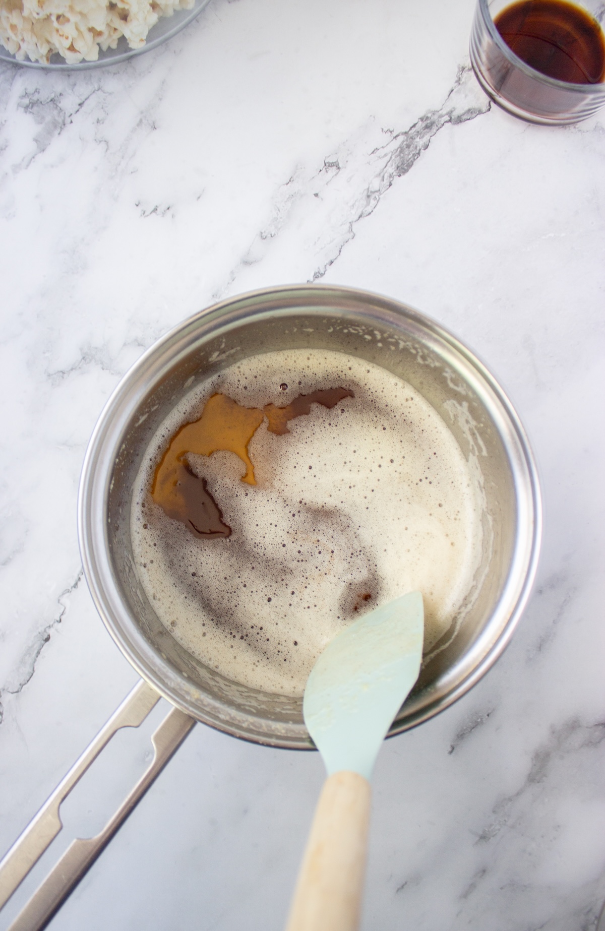 Butter foaming and browning in a saucepan with a spatula