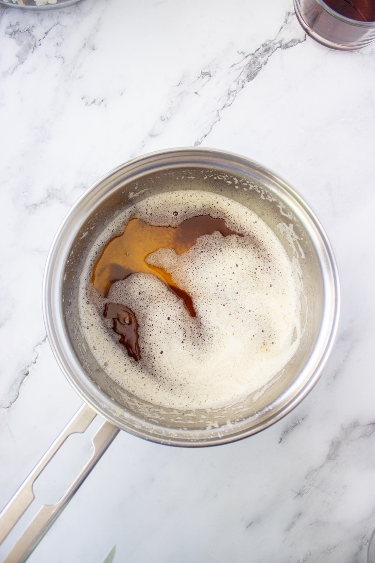 Browned butter with toasted milk solids in a stainless steel saucepan