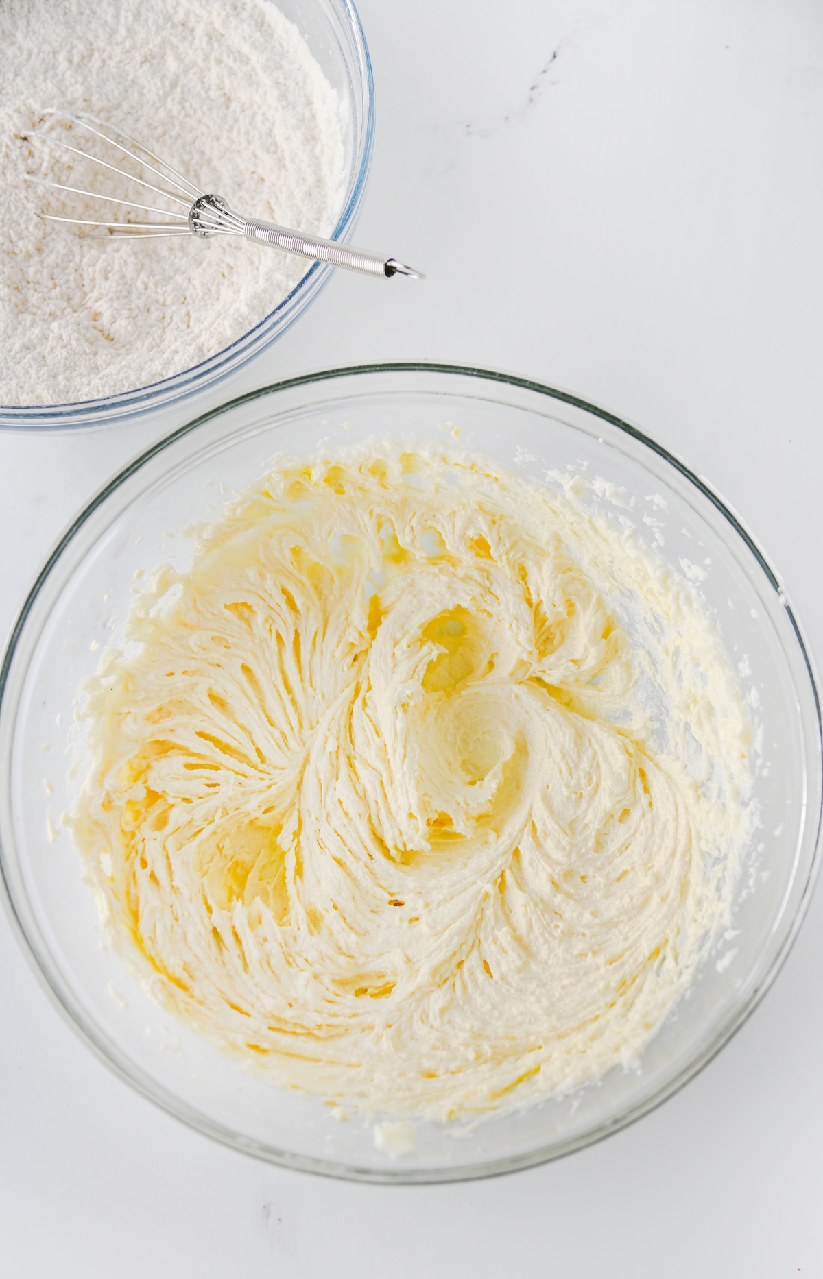 Egg yolks and vanilla beaten into creamed butter for Twix thumbprint cookie dough